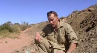 Mikael Siversson talking to camera in the Australian outback